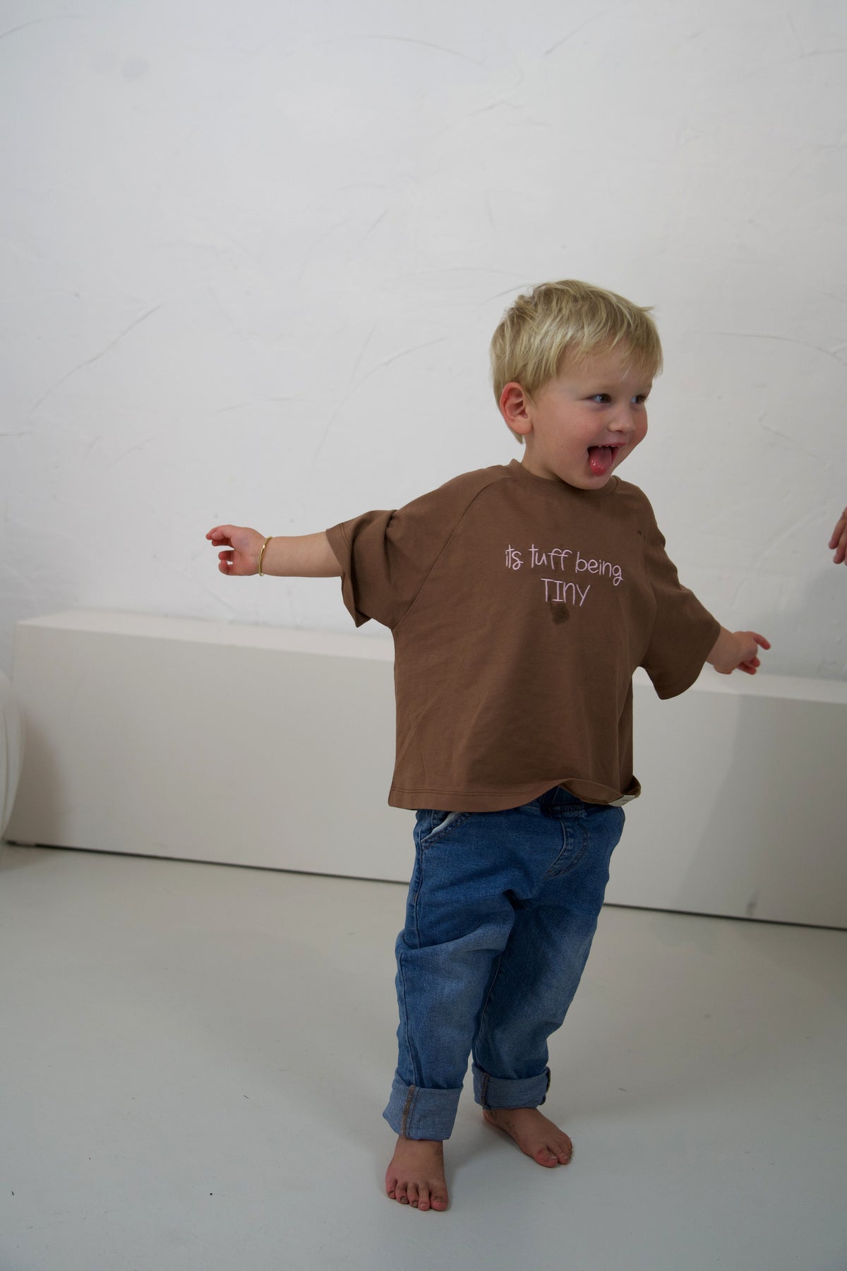 Child wearing the Mud Momenta kids tee at the Blanc Space studio shoot.