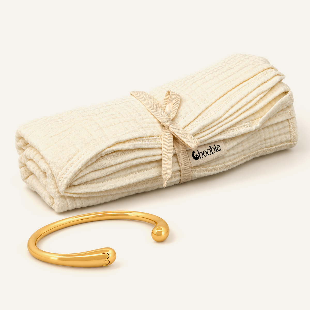 Mum and Baby Set with one gold Signature Boobie Bracelet and one folded Cloud Muslin Blanket in Oat.