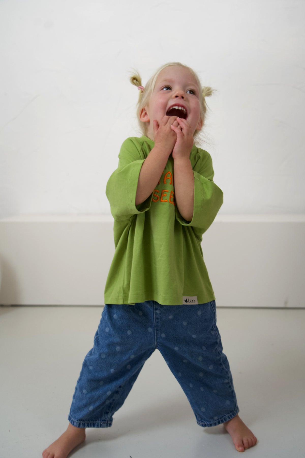 Child wearing the Leaf Momenta kids tee, showing its relaxed sleeves and fit.